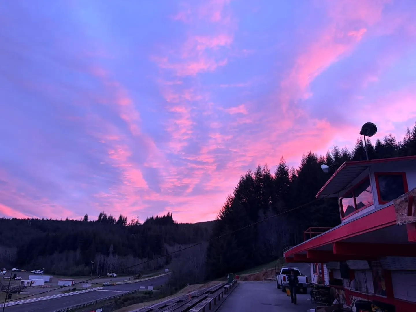 Pink sunset over the announcer tower and dirt oval at Coos Bay Speedway
